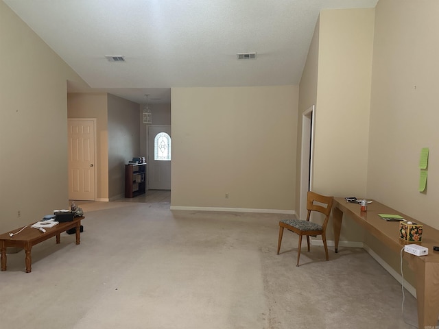 living area featuring an office area and carpet