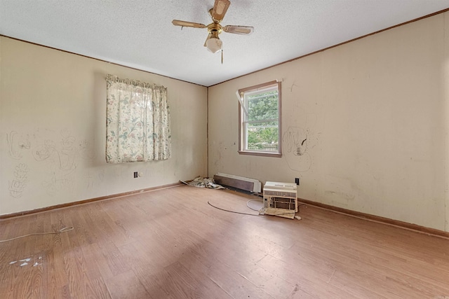 27 Arbor Oaks Dr, Sherwood, AR 72120 - spare room featuring wood finished floors, ceiling fan, and a textured ceiling