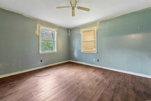 27 Arbor Oaks Dr, Sherwood, AR 72120 - spare room featuring wood finished floors, a ceiling fan, and a textured ceiling