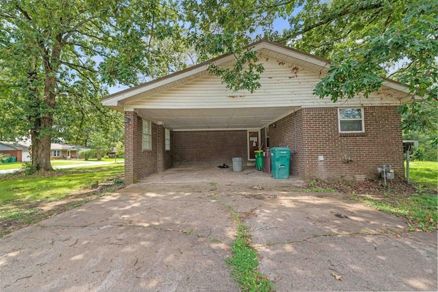 27 Arbor Oaks Dr, Sherwood, AR 72120 - view of property exterior with concrete driveway, crawl space, brick siding, and an attached carport