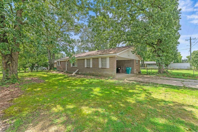 27 Arbor Oaks Dr, Sherwood, AR 72120 - view of yard with concrete driveway and an attached carport