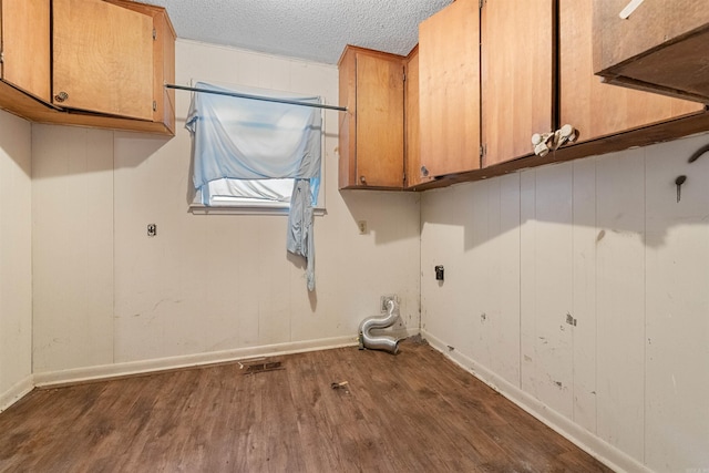 27 Arbor Oaks Dr, Sherwood, AR 72120 - washroom with cabinet space, dark wood-style flooring, and a textured ceiling