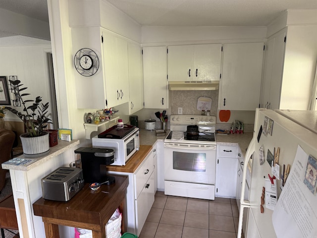 510 N 4th St, Heber Springs, AR 72543 - kitchen featuring white appliances, under cabinet range hood, light countertops, tile patterned flooring, and white cabinets