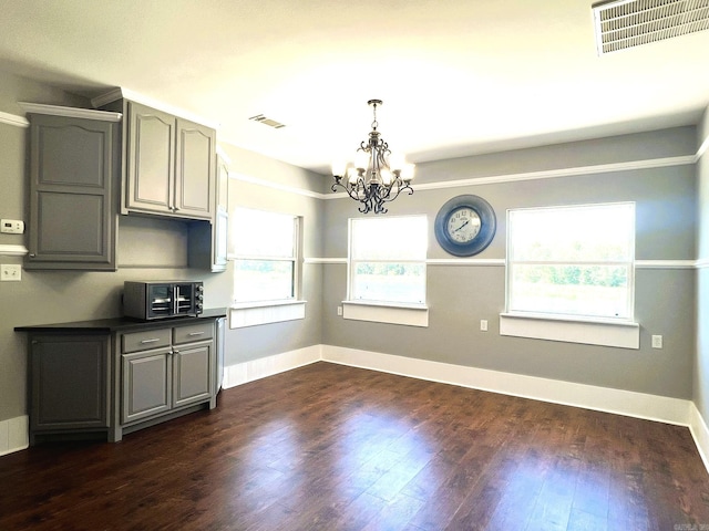 5942 Joey Ln, Texarkana, AR 71854 - unfurnished dining area with a chandelier and dark wood finished floors