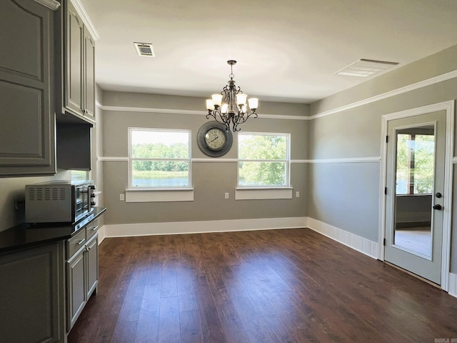5942 Joey Ln, Texarkana, AR 71854 - unfurnished dining area featuring a chandelier and dark wood-style flooring