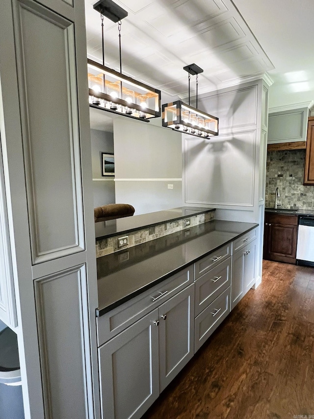 5942 Joey Ln, Texarkana, AR 71854 - kitchen with dark countertops, dishwasher, backsplash, dark wood finished floors, and gray cabinetry