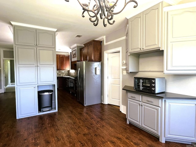 5942 Joey Ln, Texarkana, AR 71854 - kitchen with stainless steel fridge with ice dispenser, a chandelier, dark countertops, dark wood-style floors, and decorative backsplash