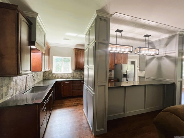 5942 Joey Ln, Texarkana, AR 71854 - kitchen with stainless steel fridge with ice dispenser, decorative backsplash, dark countertops, ornamental molding, and dark wood-style floors