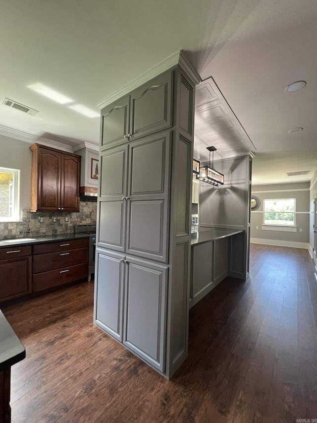 5942 Joey Ln, Texarkana, AR 71854 - kitchen with dark wood finished floors, backsplash, and ornamental molding