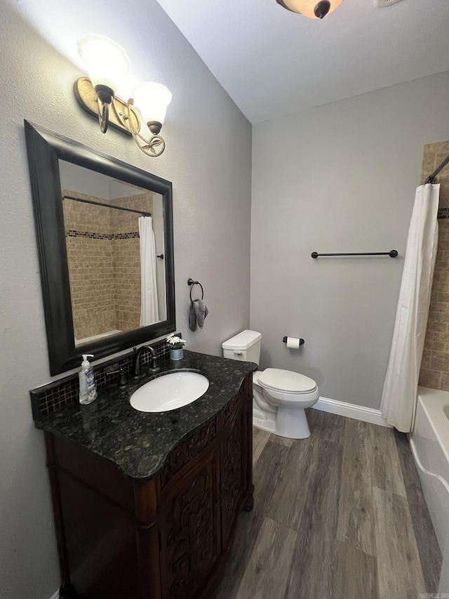 5942 Joey Ln, Texarkana, AR 71854 - bathroom featuring wood finished floors, vanity, and shower / tub combo