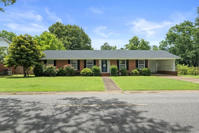 1903 W Arch Ave, Searcy, AR 72143 - ranch-style home with concrete driveway, a front yard, a carport, brick siding, and roof with shingles
