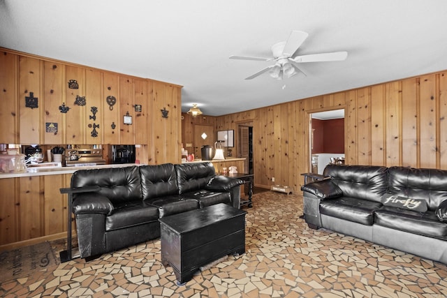 1903 W Arch Ave, Searcy, AR 72143 - living room featuring ceiling fan and wooden walls