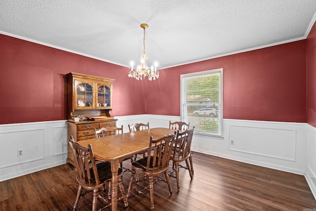 1903 W Arch Ave, Searcy, AR 72143 - dining area featuring a chandelier, wainscoting, a textured ceiling, wood finished floors, and crown molding