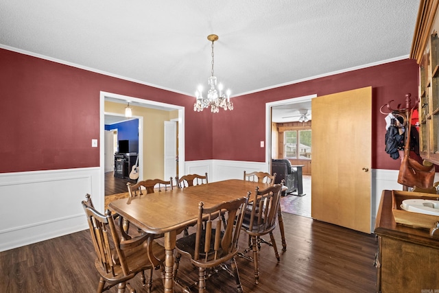 1903 W Arch Ave, Searcy, AR 72143 - dining room featuring dark wood-style floors, a wainscoted wall, a chandelier, and crown molding