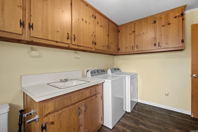 1903 W Arch Ave, Searcy, AR 72143 - washroom featuring dark wood finished floors, washer and dryer, and a textured ceiling