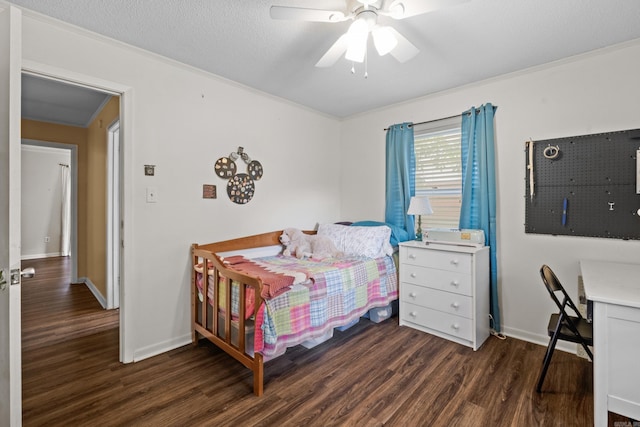 1903 W Arch Ave, Searcy, AR 72143 - bedroom with dark wood-type flooring, crown molding, and ceiling fan
