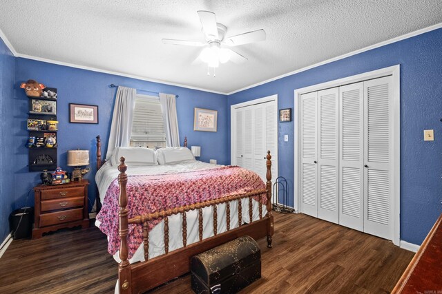 1903 W Arch Ave, Searcy, AR 72143 - bedroom with a textured ceiling, two closets, wood finished floors, a textured wall, and ornamental molding
