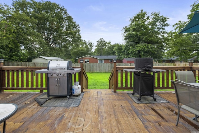 1903 W Arch Ave, Searcy, AR 72143 - wooden terrace with grilling area and a fenced backyard