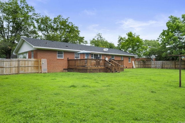 1903 W Arch Ave, Searcy, AR 72143 - rear view of property with a deck, a fenced backyard, and brick siding