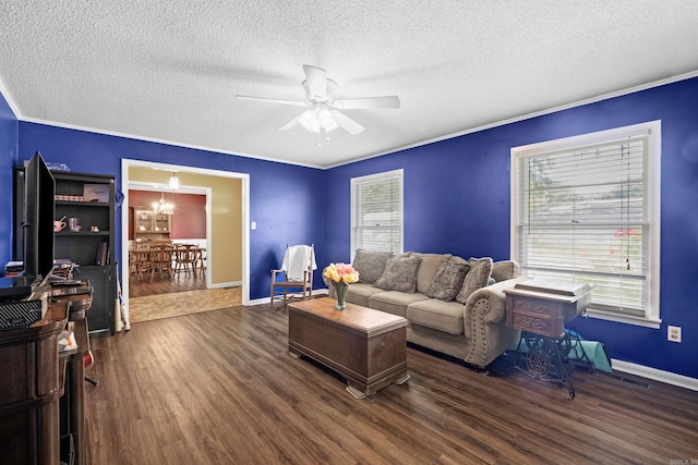 1903 W Arch Ave, Searcy, AR 72143 - living room with a textured ceiling, dark wood finished floors, a ceiling fan, plenty of natural light, and a chandelier
