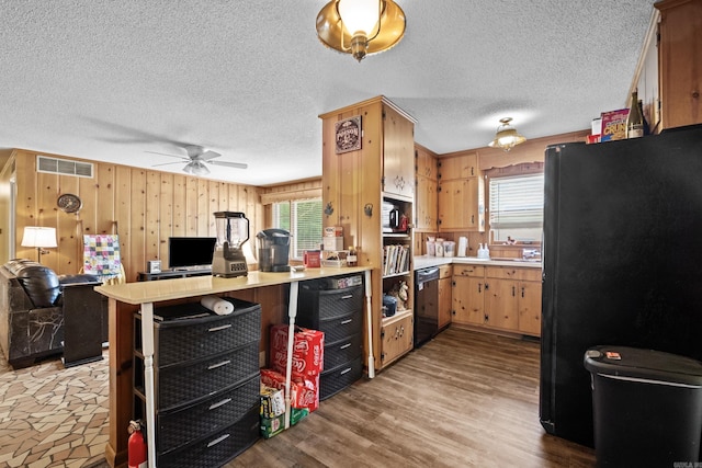 1903 W Arch Ave, Searcy, AR 72143 - kitchen with black appliances, open floor plan, plenty of natural light, light countertops, and a textured ceiling