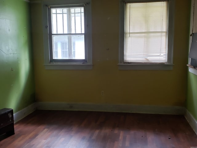 1508 W 18th Ave, Pine Bluff, AR 71603 - spare room featuring wood finished floors and plenty of natural light