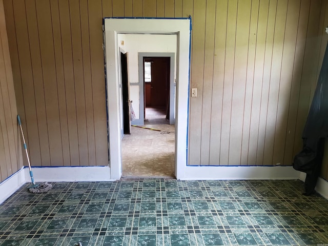 1504 W 18th Ave, Pine Bluff, AR 71603 - unfurnished room with wood walls and tile patterned floors