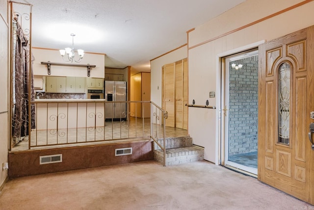 337 Lance Cir, Hot Springs, AR 71901 - carpeted entryway featuring a chandelier