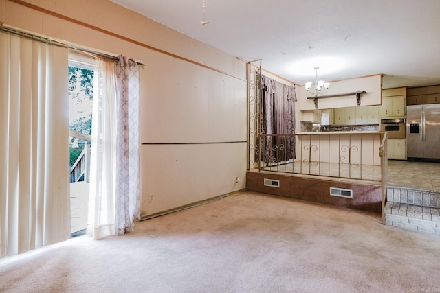 337 Lance Cir, Hot Springs, AR 71901 - kitchen with stainless steel fridge, wall oven, a chandelier, and carpet flooring