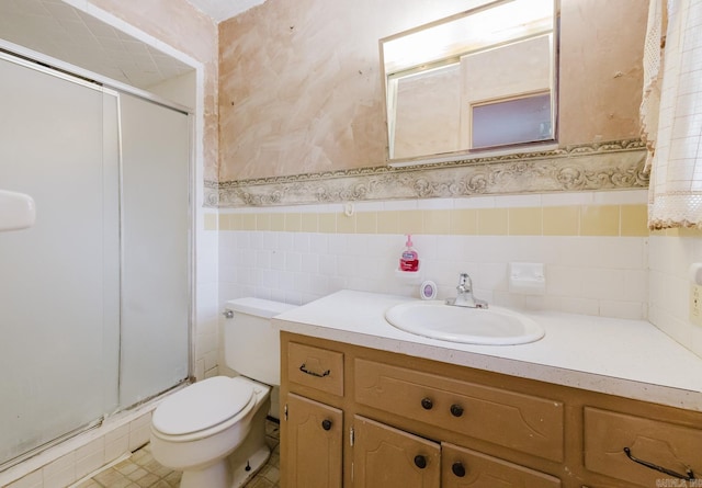 337 Lance Cir, Hot Springs, AR 71901 - bathroom featuring a shower stall, vanity, wainscoting, tile walls, and wallpapered walls