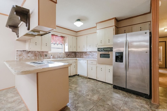 337 Lance Cir, Hot Springs, AR 71901 - kitchen with white appliances, a peninsula, tasteful backsplash, ornamental molding, and light tile patterned floors