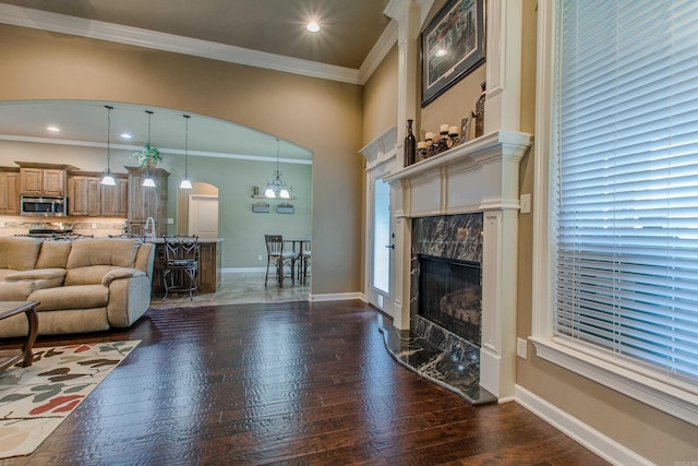 2148 Avondale Dr, Benton, AR 72019 - living room with arched walkways, ornamental molding, hardwood / wood-style flooring, and a premium fireplace