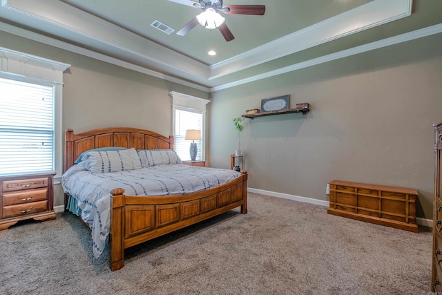 2148 Avondale Dr, Benton, AR 72019 - carpeted bedroom featuring a tray ceiling, crown molding, a ceiling fan, and recessed lighting