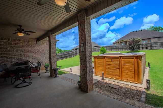 2148 Avondale Dr, Benton, AR 72019 - fenced backyard featuring a ceiling fan and a patio area