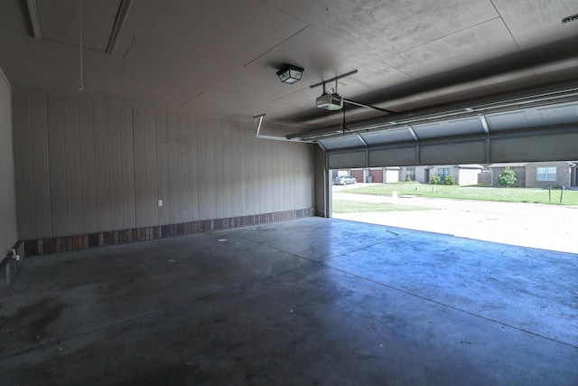 1206 Ryan Ln, Paragould, AR 72450 - garage with a garage door opener and wood walls