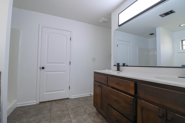 1206 Ryan Ln, Paragould, AR 72450 - bathroom with double vanity, a shower, and tile patterned flooring