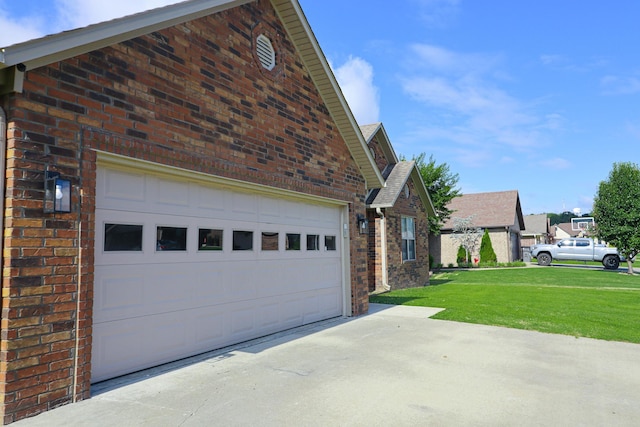 1206 Ryan Ln, Paragould, AR 72450 - view of home's exterior with driveway, a garage, brick siding, and a lawn