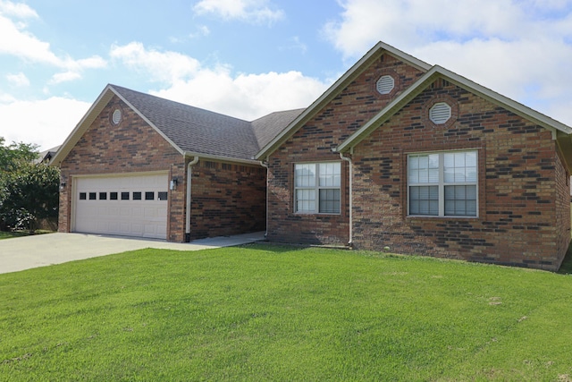 1206 Ryan Ln, Paragould, AR 72450 - view of front of property with brick siding, a garage, driveway, a front yard, and a shingled roof