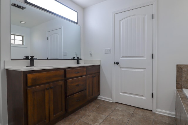 1206 Ryan Ln, Paragould, AR 72450 - bathroom featuring double vanity and tile patterned flooring