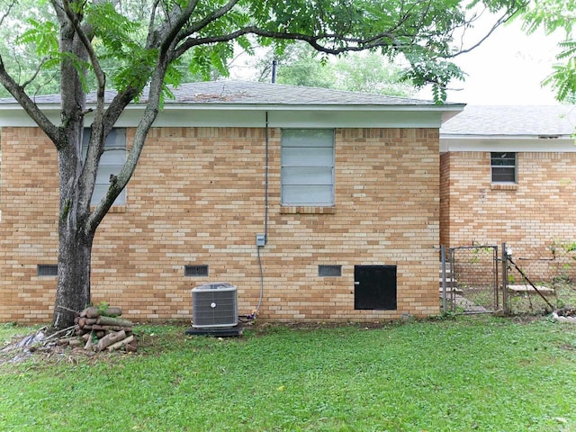 4207-4209 Moss St, North Little Rock, AR 72118 - view of property exterior featuring a gate, brick siding, a shingled roof, and crawl space
