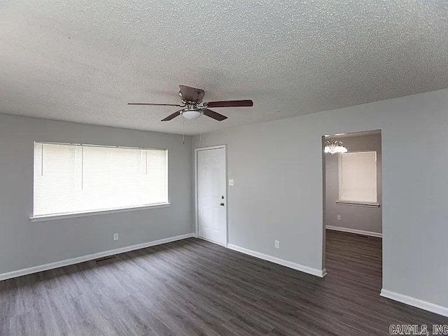 4207-4209 Moss St, North Little Rock, AR 72118 - unfurnished room featuring dark wood-style floors, a textured ceiling, and ceiling fan