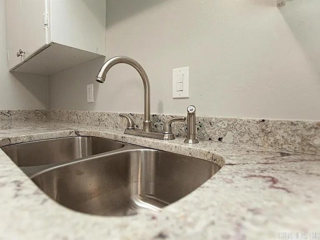4207-4209 Moss St, North Little Rock, AR 72118 - kitchen view of a sink and white cabinets