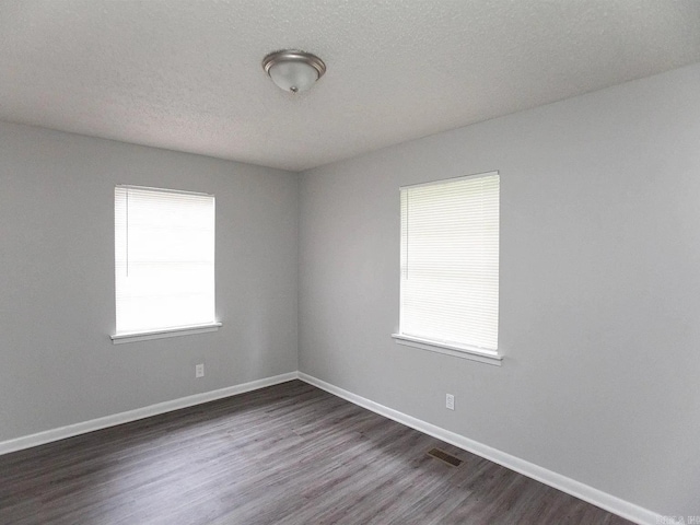 4207-4209 Moss St, North Little Rock, AR 72118 - spare room with dark wood-type flooring and baseboards