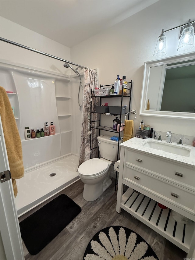 716 S Shore Dr, Horseshoe Bend, AR 72512 - bathroom with wood finished floors, a stall shower, and vanity