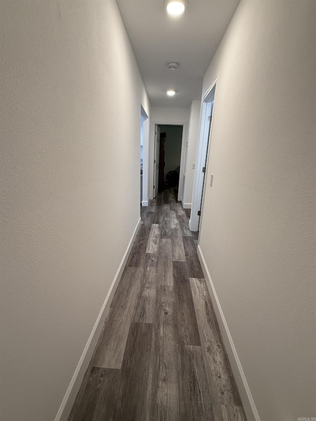 716 S Shore Dr, Horseshoe Bend, AR 72512 - corridor featuring dark wood-style flooring and baseboards