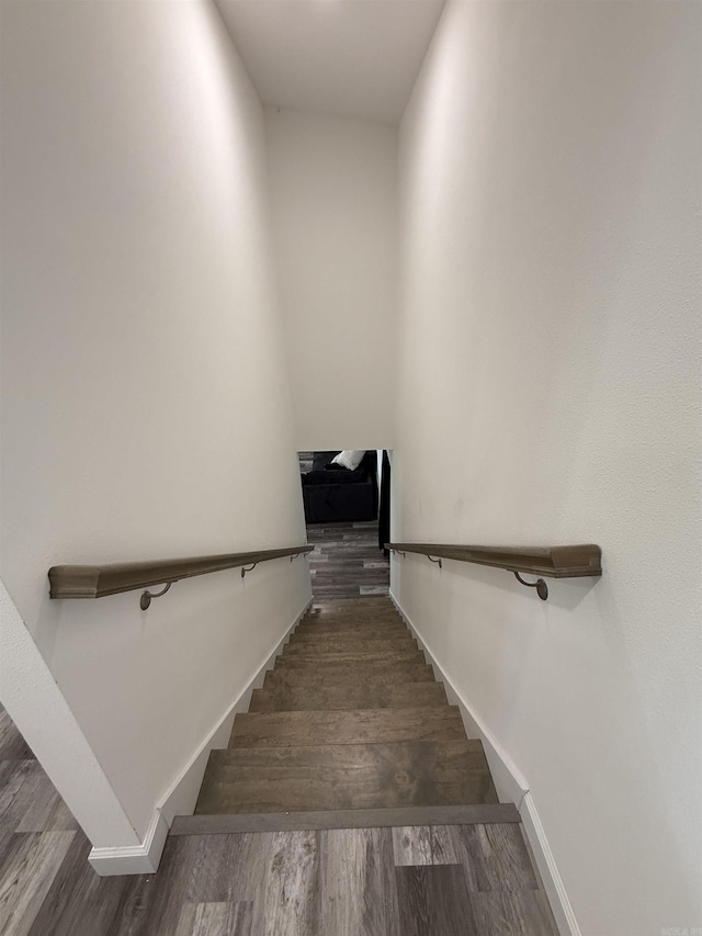 716 S Shore Dr, Horseshoe Bend, AR 72512 - staircase featuring baseboards and wood finished floors