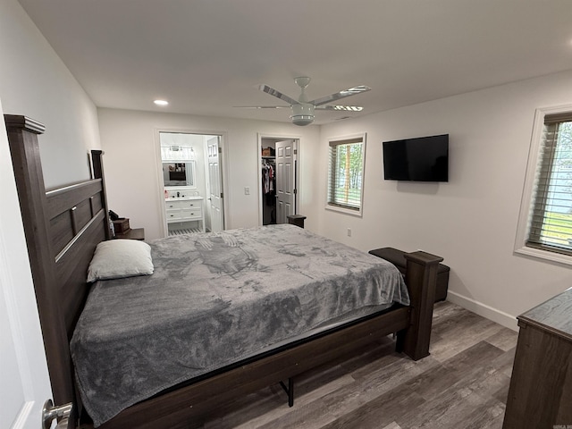 716 S Shore Dr, Horseshoe Bend, AR 72512 - bedroom featuring dark wood-type flooring, recessed lighting, a walk in closet, a ceiling fan, and ensuite bath