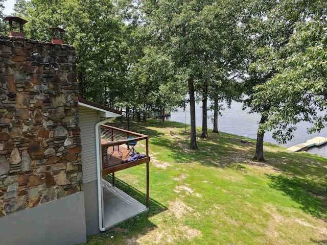 716 S Shore Dr, Horseshoe Bend, AR 72512 - view of grassy yard featuring a deck with water view