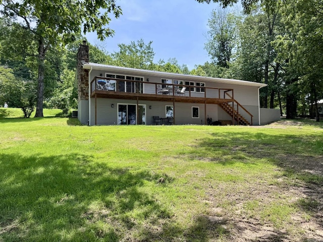 716 S Shore Dr, Horseshoe Bend, AR 72512 - rear view of house featuring a deck, stairway, a chimney, and a lawn