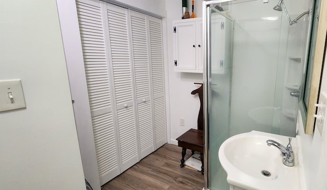 1000 Waverly Rd, Mountain Home, AR 72653 - full bathroom featuring a closet, wood finished floors, and a stall shower